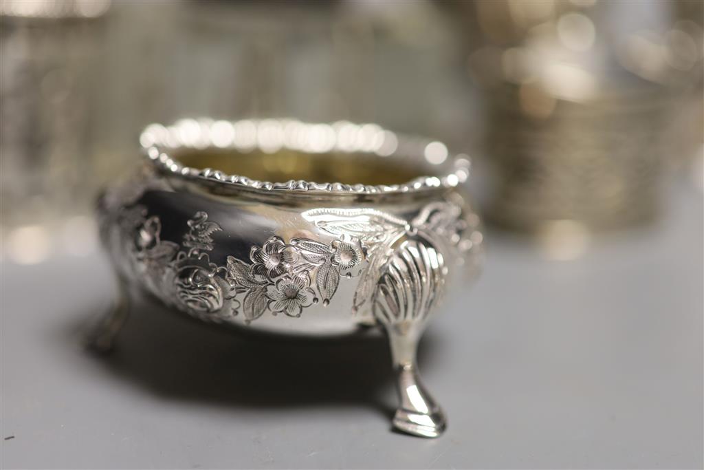 A collection of small silver items, comprising a George III helmet-shaped embossed cream jug,